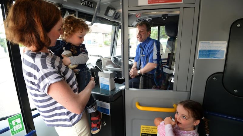 Claire Micks with her children, Lucy (4) and Andy (2), on the 83 bus going into Dublin city. Photograph: Dara Mac Dónaill
