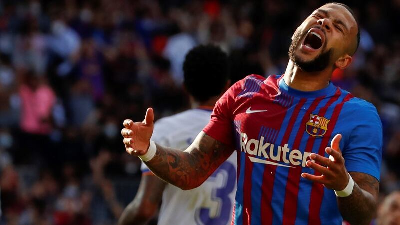 Barcelona striker Memphis Depay reacts during the  La Liga  match against Real Madrid at Camp Nou stadium. Photograph: Alberto Estevez/EPA