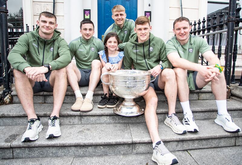 Kerry’s Diarmuid O’Connor, Paul Murphy, Killian Spillane, Gavin White and Tadhg Morley with Chloe Jarrell during the newly-crowned All-Ireland champions visit to Temple Street Children's Hospital, Dublin. Photograph: Dan Clohessy/Inpho