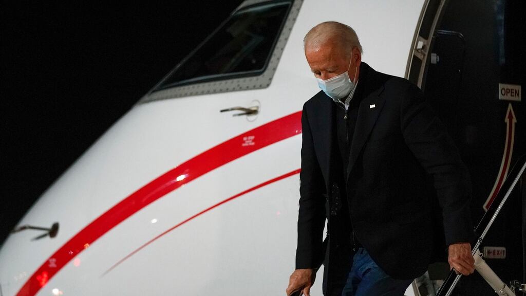 US president-elect Joe Biden steps off a plane at New Castle Airport in New Castle, Delaware on Tuesday. Photograph: Patrick Semansky/AP