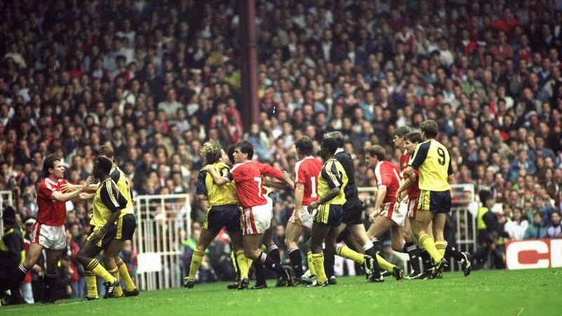 Manchester United and Arsenal players fight on the pitch during Arsenal’s 1-0 win at Old Trafford on October 20th, 1990. Photograph: Russell Cheyne/Allsport
