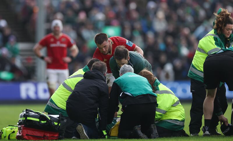 Alex Nankivell checks on Connacht's Cian Prendergast after a tackle which saw the Munster centre shown a red card. Photograph: James Crombie/Inpho