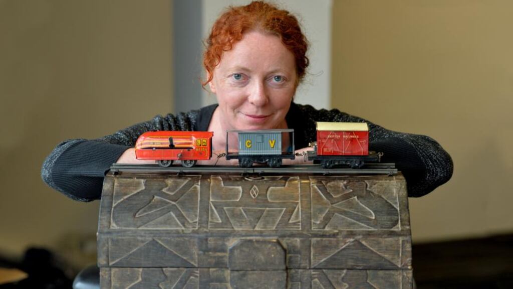 Trained eye: Rosita Boland with the carved wooden box and tin-plate trains she purchased with her €100. Photograph: Alan Betson