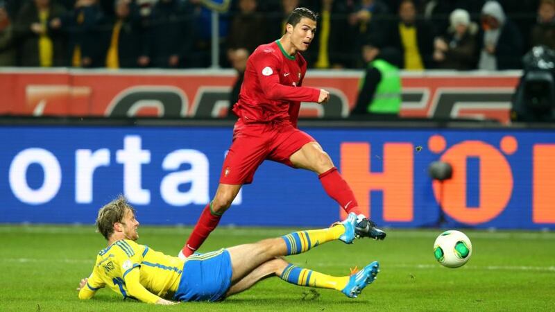 Cristiano Ronaldo of Portugal scores his second against Sweden at Friends Arena in Stockholm. Photograph: Martin Rose/Getty Images