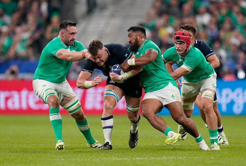 Scotland's Jack Dempsey is tackled by Ireland's Jack Conan (left) and Bundee Aki during the Rugby World Cup match at the Stade de France in Paris. Photograph: Andrew Matthews/PA