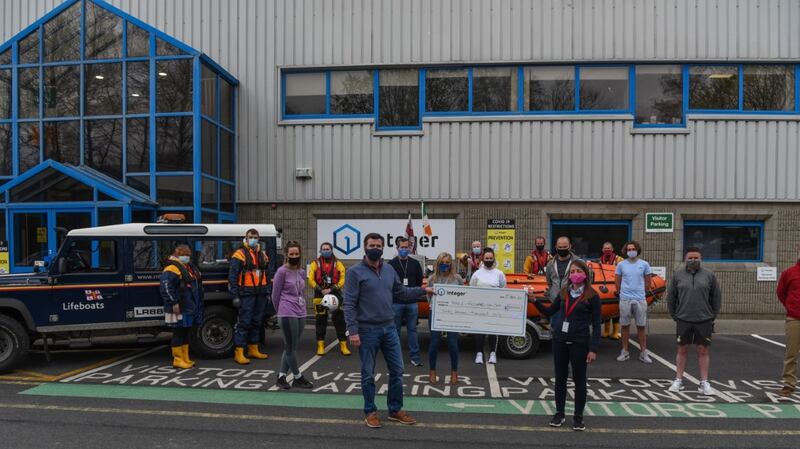 Fethard-on-Sea RNLI fundraising secretary Sarah Bates accepting the cheque for €37,000 from Integer spokesperson Seamus Hamilton