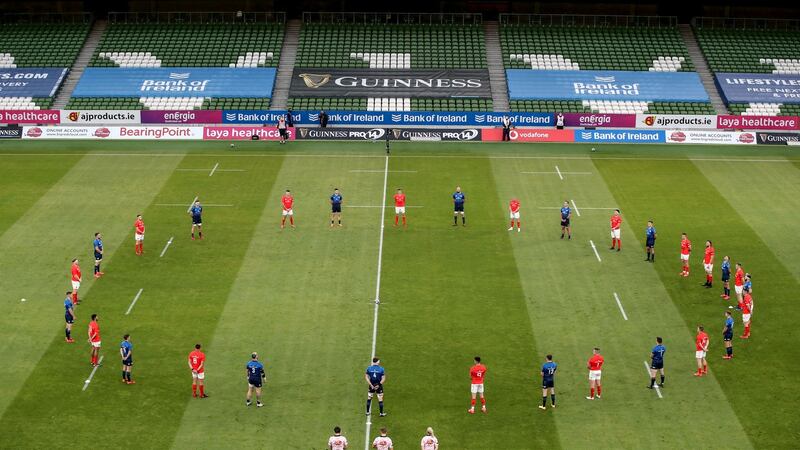 Leinster and Munster stand for a minute’s silence in aid of #RugbyAgainstRacism. Photograph: Inpho