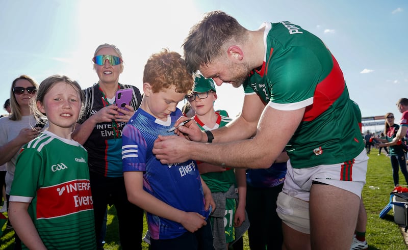 Aidan O'Shea signs autographs for young fans, which has been a common sight throughout the Mayo footballer's career. Photograph: James Lawlor/Inpho