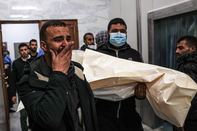 Mourners transport a body of Palestinian, killed during an Israeli strike, from the EU hospital in Khan Yunis in the southern Gaza Strip. Photograph: Said Khatib/AFP via Getty Images