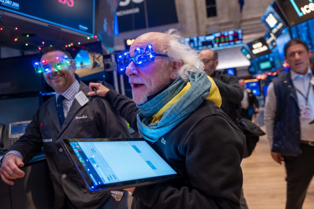 New York, new year: Wall Street traders, including Peter Tuchman (centre), working on the floor of the New York Stock Exchange. Photograph: Spencer Platt/Getty Images