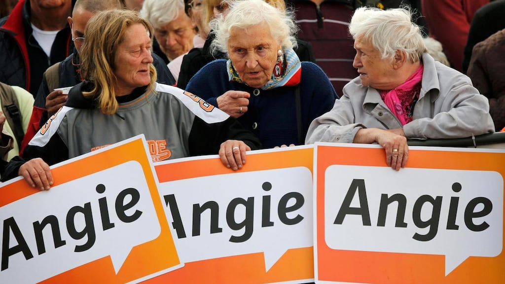 Elderly supporters hold placards backing German chancellor and conservative Christian Democratic Union (CDU) leader Angela Merkel, at a CDU election campaign rally in Magdeburg yesterday. Merkel is seeking a third term in a parliamentary election on September 22nd. Photograph: Fabrizio Bensch/Reuters