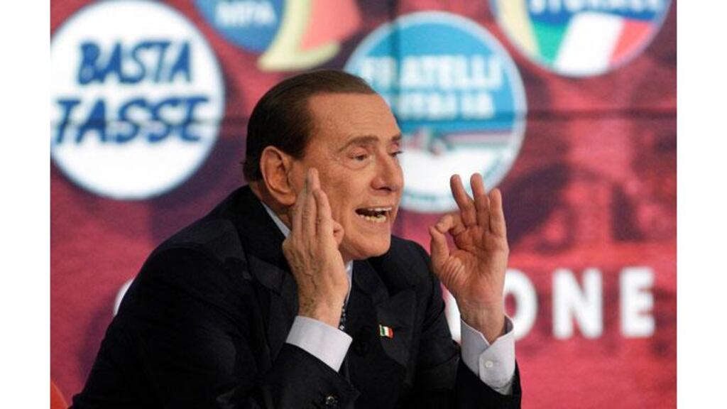 Italy's former prime minister Silvio Berlusconi gestures as he appears as a guest on the RAI television show Porta a Porta (Door to Door) in Rome last night. Photograph: Reuters