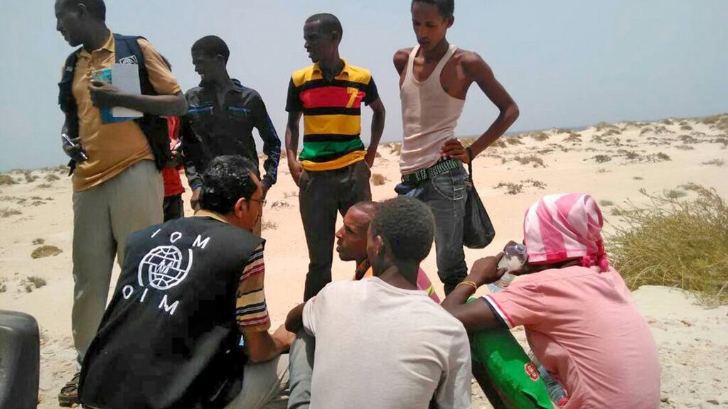International Organization for Migration staff assisting Somali and Ethiopian migrants, who were reportedly forced into the sea by smugglers, on a beach in Shabwa, Yemen. Photograph: EPA/UN Migration Agency (IOM) 2017
