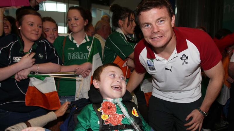 Matthew McGrath from Wexford meets his hero Brian O’Driscoll at Dublin Airport in 2011 as the Irish rugby team returned from New Zealand. Photograph: Colin Keegan/Collins, Dublin
