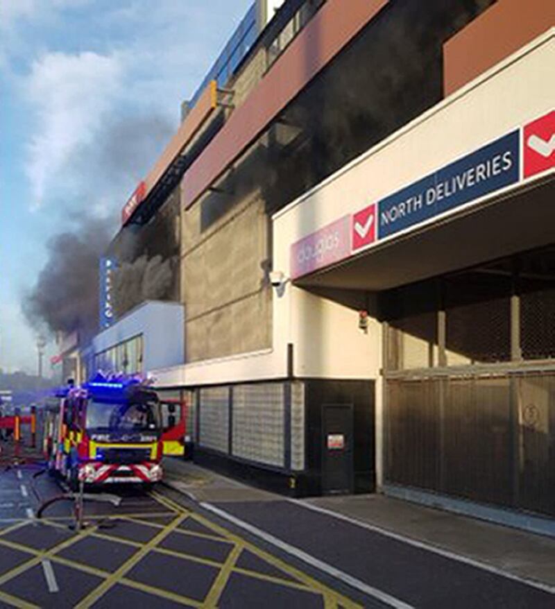 Cork City Fire Brigade crews attending the fire in the multi-storey parking facility of the Douglas Village Shopping Centre in Cork on Saturday. Photograph: Cork City Fire Brigade/PA Wire