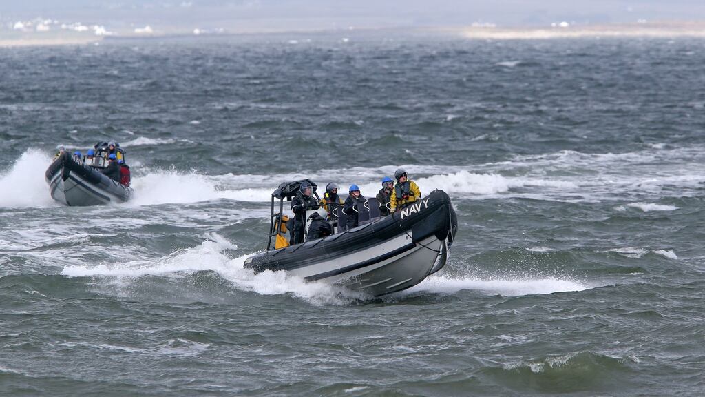 Family members of the three missing crew members of Rescue 116 return from the LE Eithne to Blacksod pier on Wednesday after they were brought to Blackrock lighthouse to survey the scene of the helicopter crash. Photograph: Colin Keegan/Collins