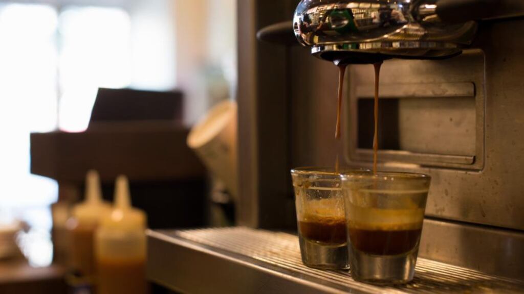 Freshly brewed espresso pours into shot glasses at a Starbucks Coffee Korea Co. store in Gimpo, South Korea. Photograph: SeongJoon Cho/Bloomberg