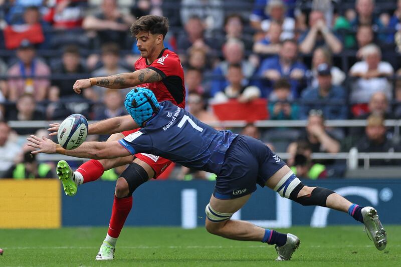 Toulouse's French fly-half Romain Ntamack clears the ball under pressure from Leinster's flanker Will Connors. Photograph: by Adrian Dennis/AFP via Getty Images