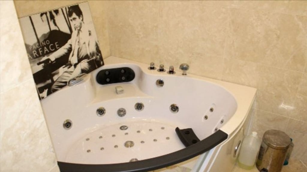 A picture of Al Pacino as Scarface sits next to a hot tub in the Finglas home of Jason Boyle, which was part of a proceeds of crime case. Image: CAB.