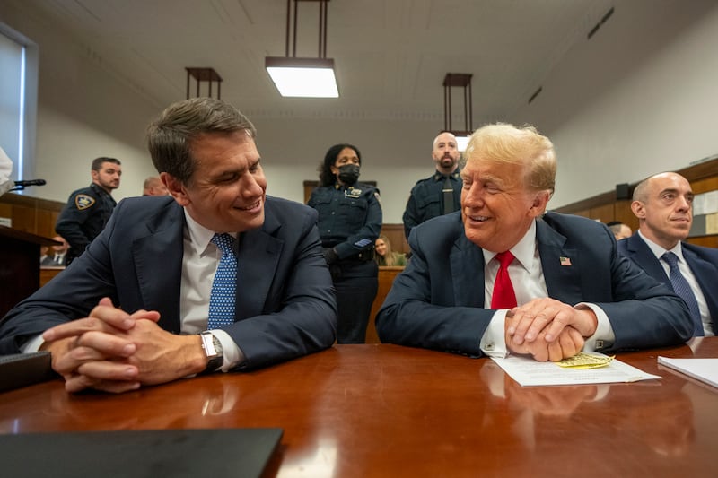 Former US president Donald Trump shares a light moment with his lawyer Todd Blanche during his trial at Manhattan Criminal Court on Tuesday. Photograph: Steven Hirsch/AP