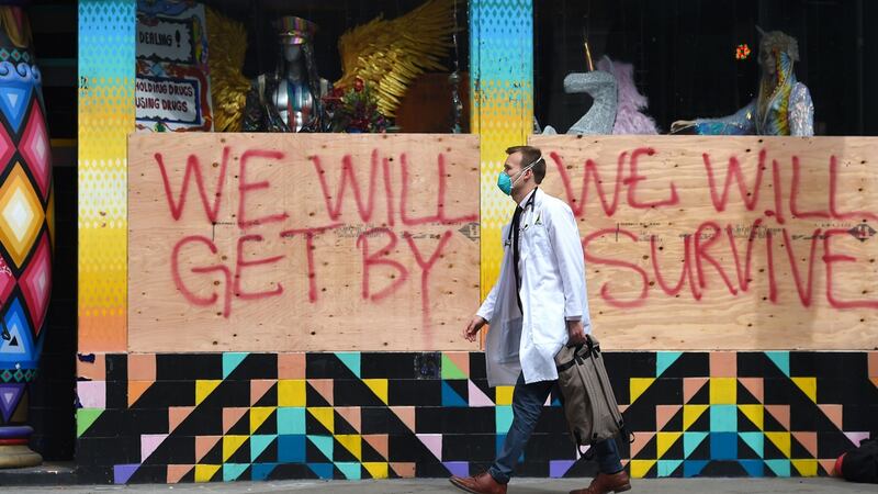 Stuart Malcolm, a doctor with the Haight Ashbury Free Clinic visits homeless people to talk about corona virus in San Francisco on March 17th. Photograph: Josh Edelson/AFP