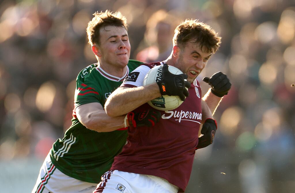 Paul Conroy of Galway under pressure from Mayo’s Paul Towey during the recent league clash at Castlebar. Photograph: James Crombie/Inpho