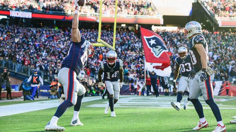 Rob Gronkowski touches down for the Patriots against the Dolphins. Photograph: Adam Glanzmann/Getty