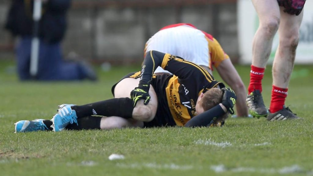 Colm Cooper suffers an injury early in the match at O’Moore Park. Photograph: Donall Farmer/Inpho