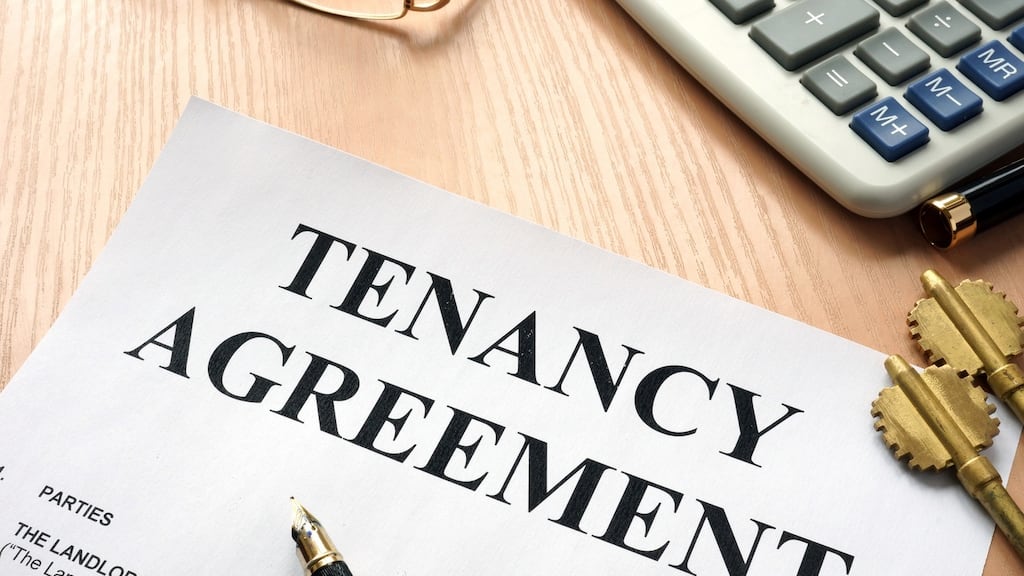 Tenancy agreement and keys from home in a real estate agency.