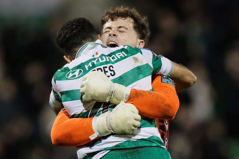 Shamrock Rovers' Roberto Lopes and goalkeeper Ed McGinty celebrate after winning the league title by beating Galway United. Photograph: Laszlo Geczo/Inpho