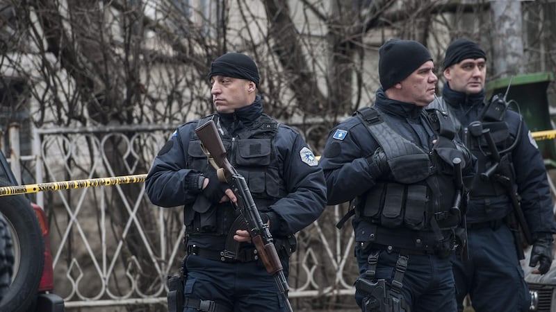 Kosovo police officers secure the area where Oliver Ivanovic was killed in Mitrovica on Tuesday. Photograph: Armend Nimani/AFP/Getty Images