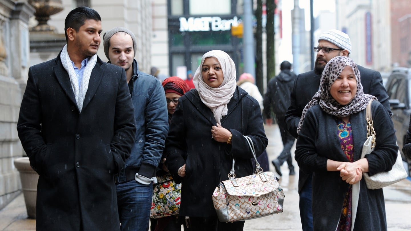 Second from left, Yusuf Syed, brother of Adnan Syed, family friend Rabia Chaudry, and, right, Shamim Rahman, mother off Yusuf and Adnan, leave Courthouse East during a lunch recess on the fifth day of hearings on whether Syed should get a new trial in the 1999 murder of Hae Min Lee on February 9th, 2016 in Baltimore, Md. Photograph: Kim Hairston/ Getty Images
