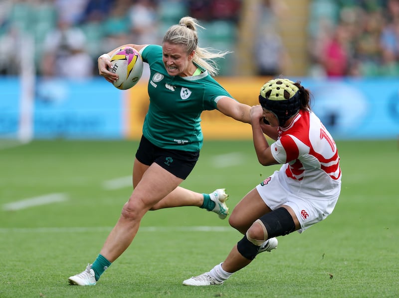 Stacey Flood of Ireland runs with the ball as she is challenged by Mana Furuta of Japan. Photograph: David Rogers/Getty Images