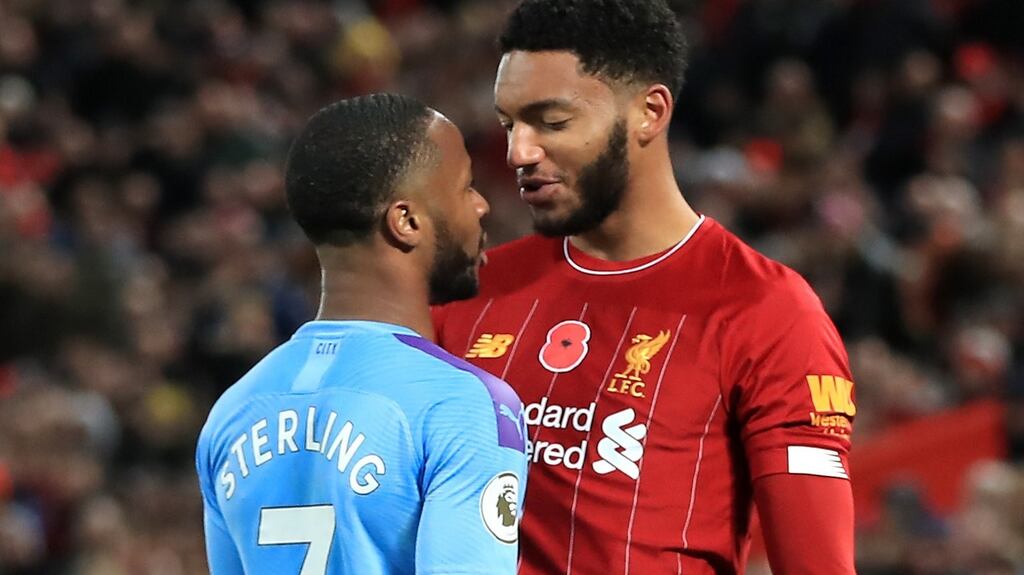 Liverpool’s Joe Gomez and Manchester City’s Raheem Sterling clash during the Premier League match at Anfield. Photograph: PA