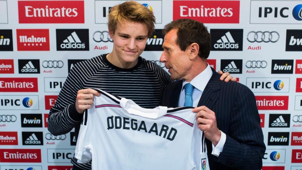 Norway international Martin Odegaard, with Real Madrid’s representative Emilio Butragueno, after the teenager signed for the Spanish giants. Photograph: Andres Kudacki/AP