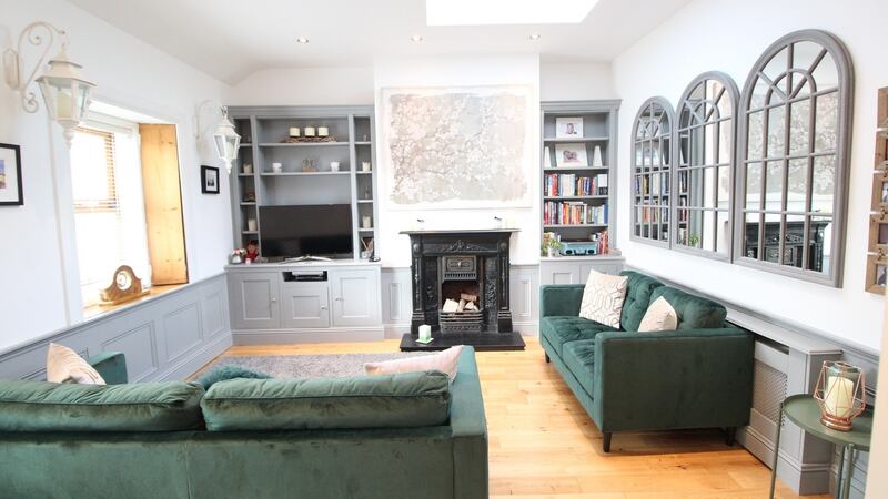 The owners of number 21 have made clever use of mirrors, which reflect light around the sitting room