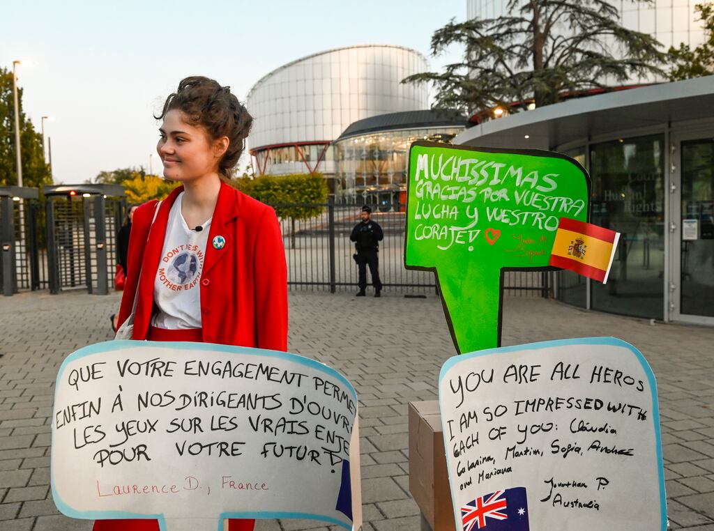 Legal co-ordinator Ida Edling outside the European Court of Human Rights with messages of support from around the world for the six plaintiffs. Photograph: Pascal Bastien/AP