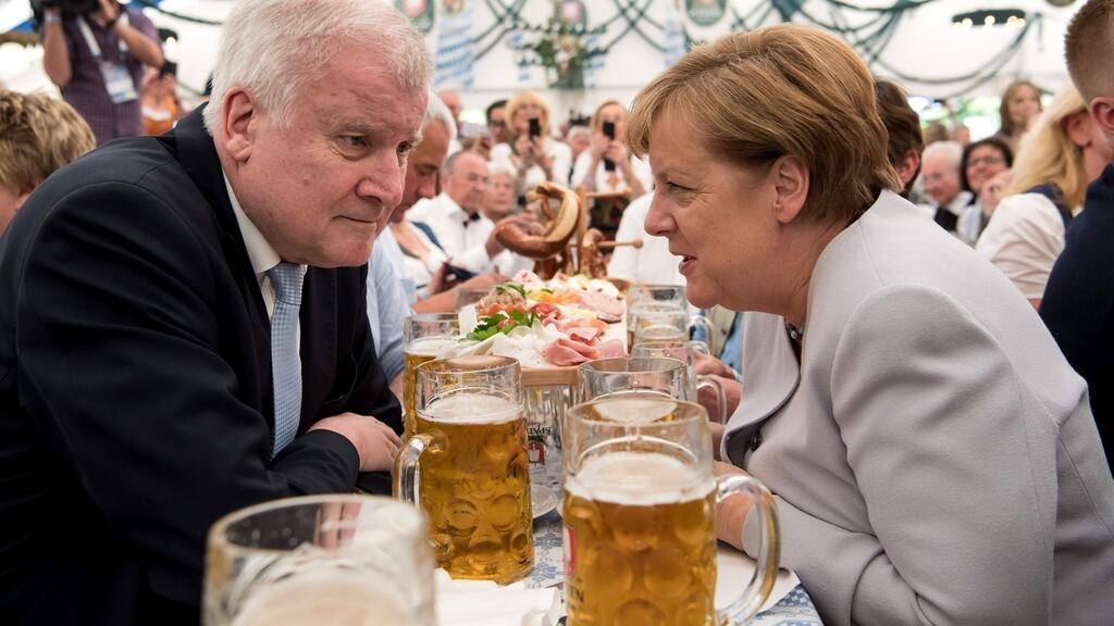 German Chancellor Angela Merkel  and Horst Seehofer  in a beer tent during a joint campaigning event of the Christian Democratic Union and the Christian Social Union  in Munich.   Photograph:  AFP/Getty Images