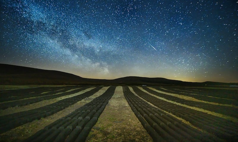 A meteor travels across the right of the horizon during the Lyrids meteor shower, viewed from the Dark Sky Park in Ballycroy, Co Mayo. Photograph: Michael McLaughlin
