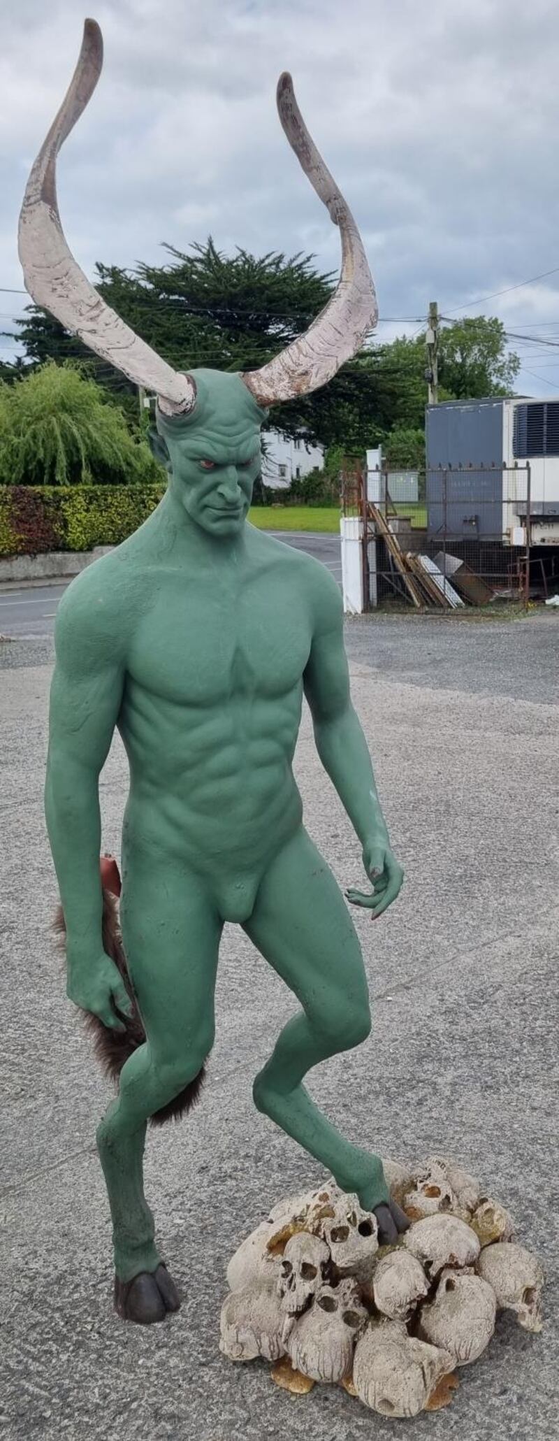 Horned green man on a bed of skulls, is one of the props in Sean Eacrett's sale €200-€400