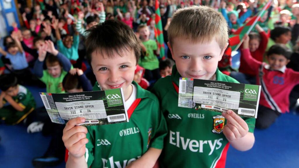 Tom Donnellan and Shane Flanagan-Trias who won a ticket each to the All-Ireland final during a school draw at Scoil Íosa, Ballyhaunis, Co Mayo, yesterday. Photograph: James Crombie/INPHO