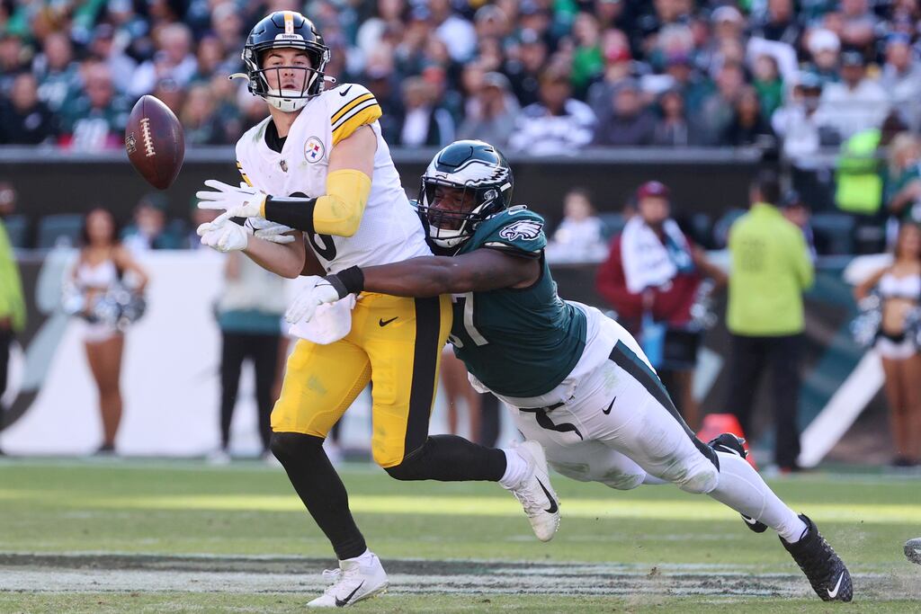 Javon Hargrave of the Philadelphia Eagles forces a fumble from Kenny Pickett of the Pittsburgh Steelers in the fourth quarter at Lincoln Financial Field. Photograph: Tim Nwachukwu/Getty Images