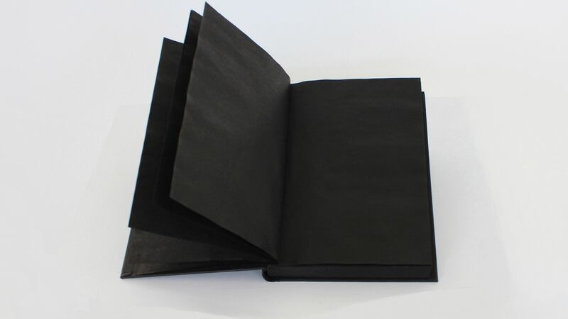 Black Book book saturated with black ink, 2019. Photograph: Marie Hanlon