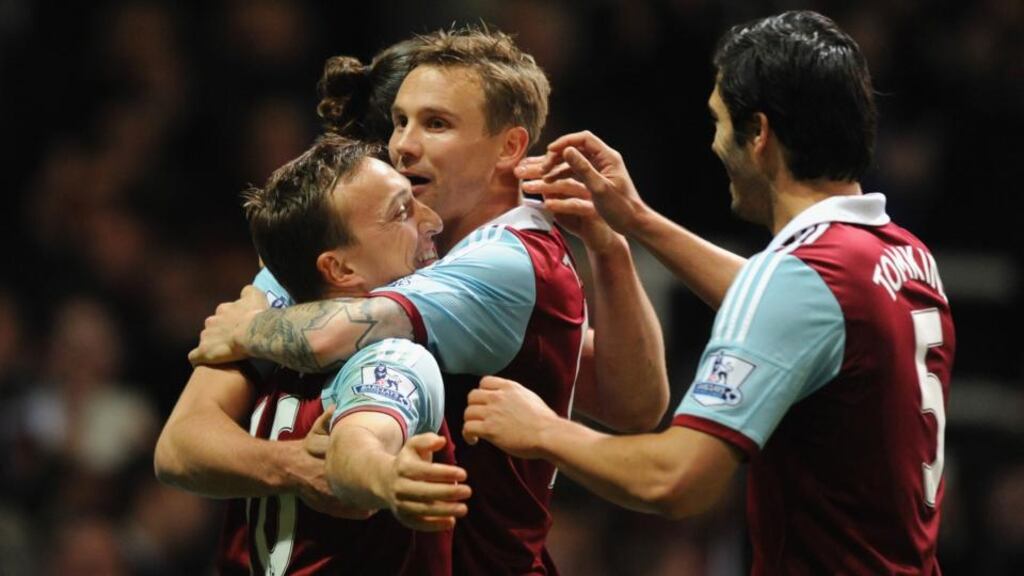 Mark Noble (left) of West Ham celebrates scoring the opener against Hull City at Boleyn Ground. Photograph: Steve Bardens/Getty Images