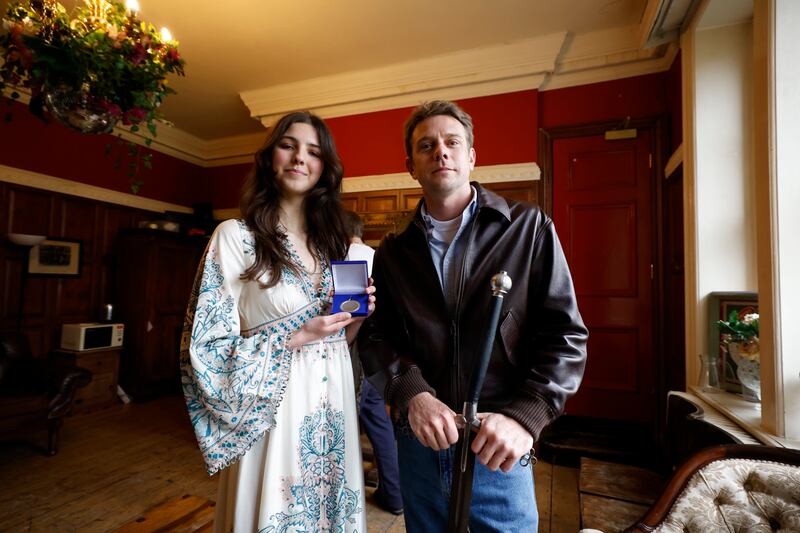 Perin Winders, treasurer of the University Philosophical Society, presents the Honorary Patronage to Jonathan Anderson. Photograph: Nick Bradshaw