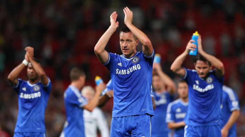 John Terry of Chelsea and his team-mates applaud the fans at the end of the 0-0 draw against Manchester United at Old Trafford. Photo by Alex Livesey/Getty Images