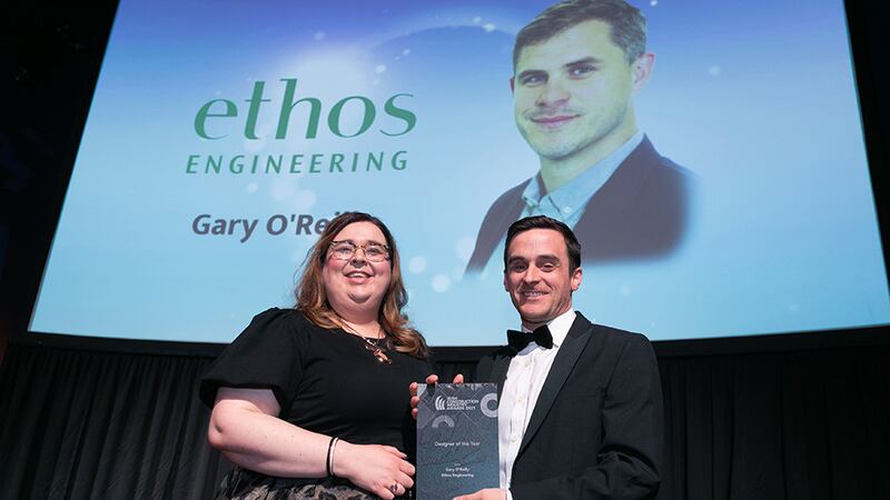 Claire McGann, Logistics Manager, HALT Natural Fire Retardant Treatment, presents the Designer of the Year Award to Gavin Murphy, Ethos Urbanism on behalf of Gary O'Reilly, Ethos Engineering.