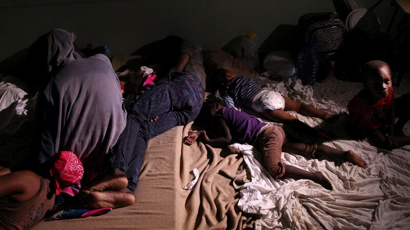 Locals rest inside a shelter before the arrival of the Hurricane Maria in Punta Cana, Dominican Republic, September 20, 2017. REUTERS/Ricardo Rojas