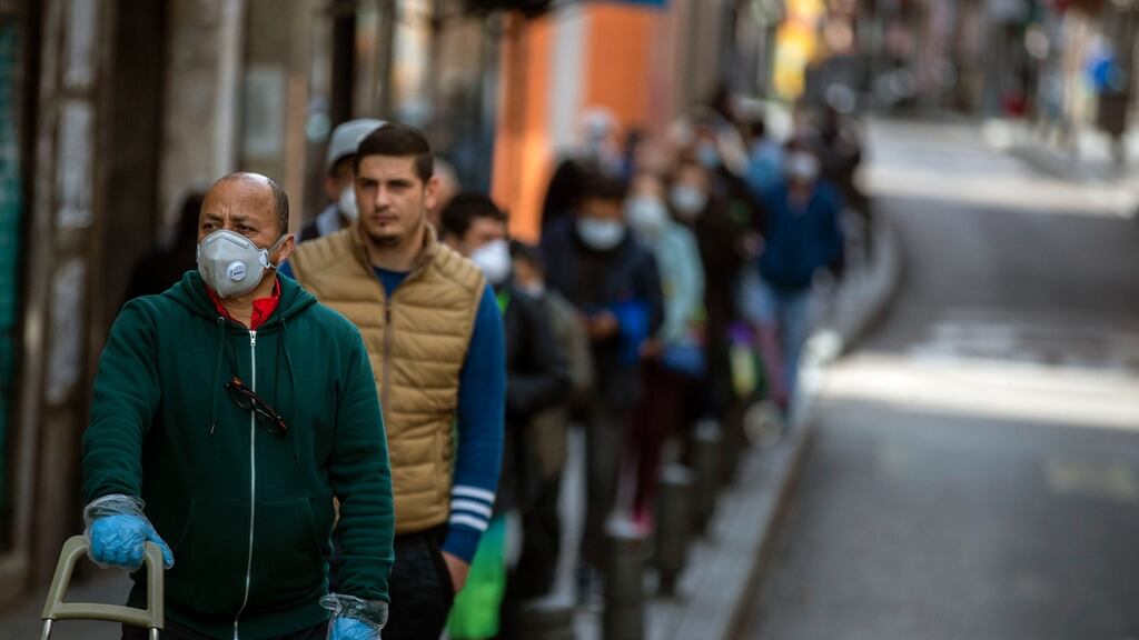 People line up to buy supplies from a supermarket, as the lockdown to combat the spread of coronavirus continues in Madrid, Spain on April 11th. Photograph: Manu Fernandez/AP