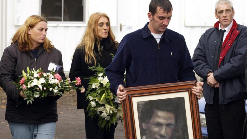 Family members carry flowers and a picture of their mother Jean McConville. Mrs McConville, 37, was abducted and murdered by the IRA in 1972. Photograph: Paul Faith/PA Wire